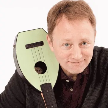 Danno Sullivan, a MemberFix client, holding a small stringed instrument