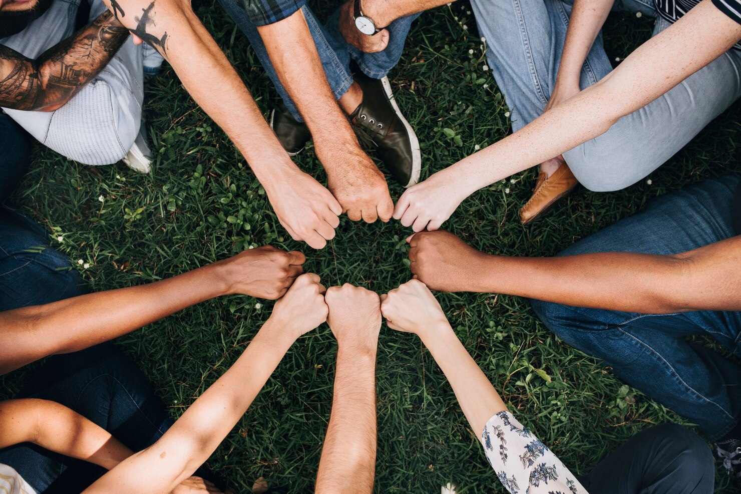 BuddyBoss Custom Development diverse community with hands circle - BuddyBoss Custom Development